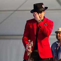 John adjusts his hat