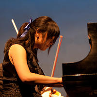 Angelina May on piano